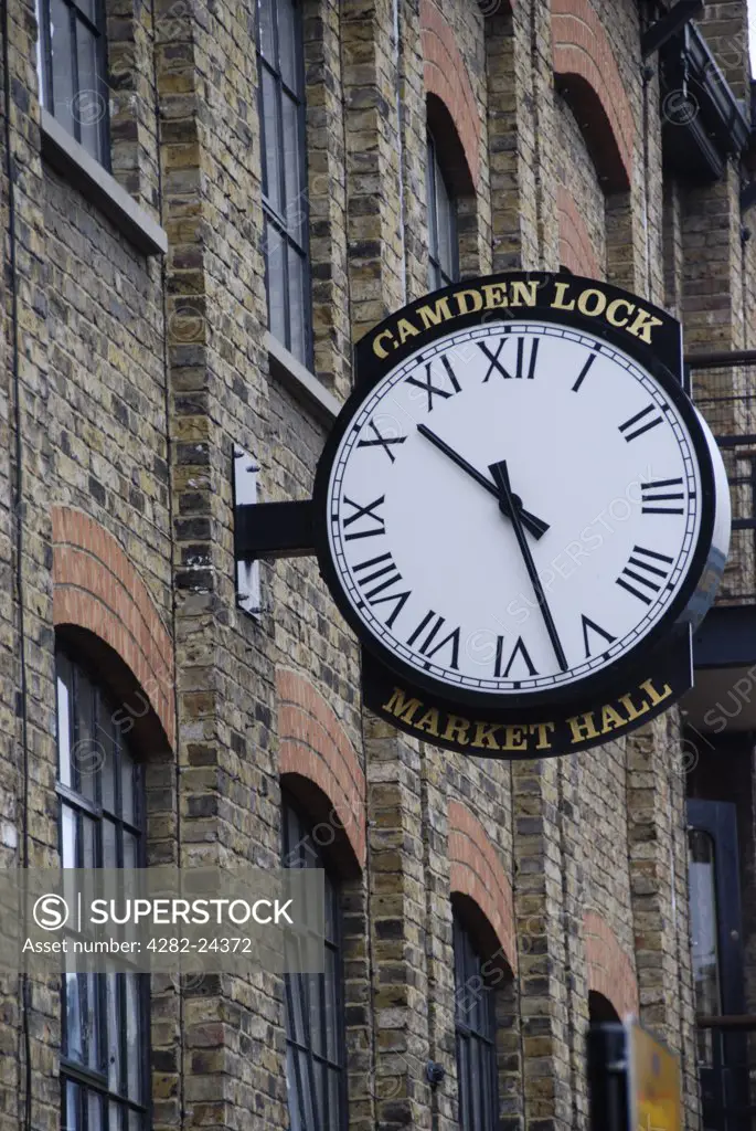 England, London, Camden Town. A clock on the exterior of the Market Hall building at Camden Lock Market.