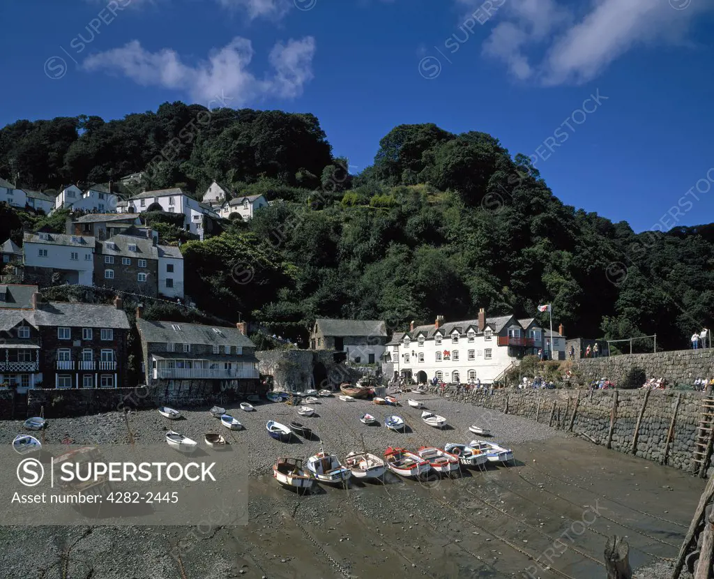 England, Devon , Clovelly. Boats in the harbour at low tide.