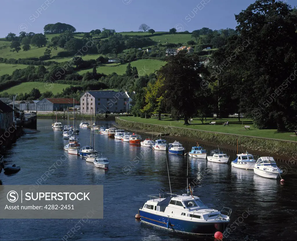 England, Devon, Totnes. Boats on the River Dart viewed from the town bridge.