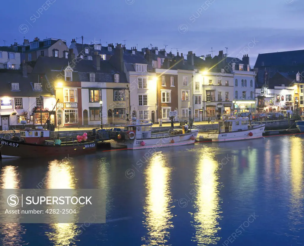 England, Dorset, Weymouth. Dusk settles on the old harbour at Weymouth.