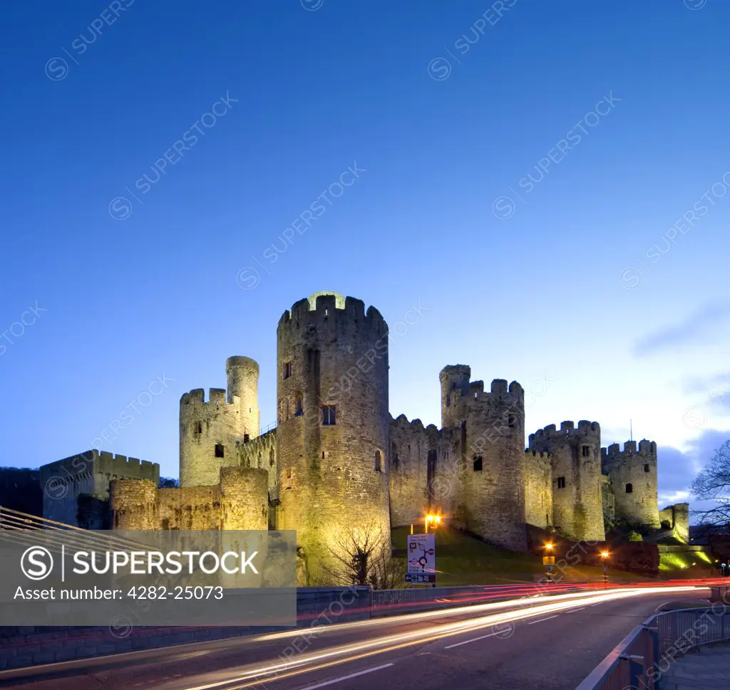Wales, Clwyd, Conwy Castle. Conwy Castle lit up at dusk.