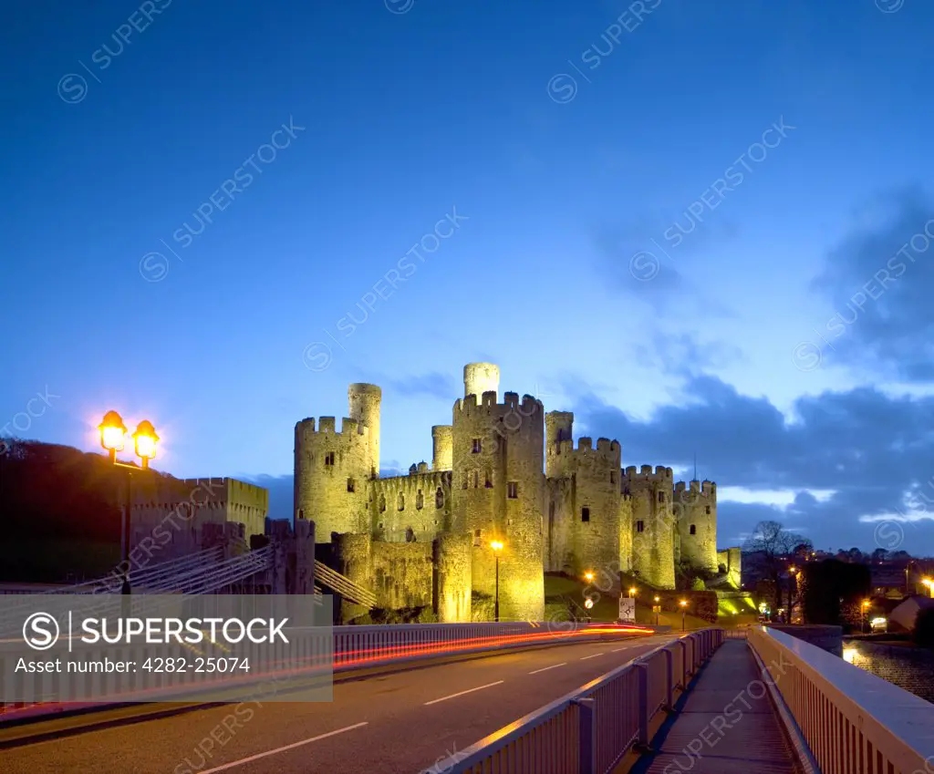 Wales, Clwyd, Conwy Castle. Conwy Castle lit up at dusk.