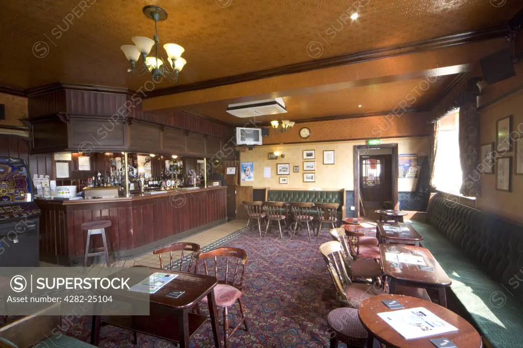 England, North Yorkshire, Masham. The Interior of a traditional British country pub. Around 90% of beer sold in the UK is produced in the UK and 28 million pints of beer are consumed every day.