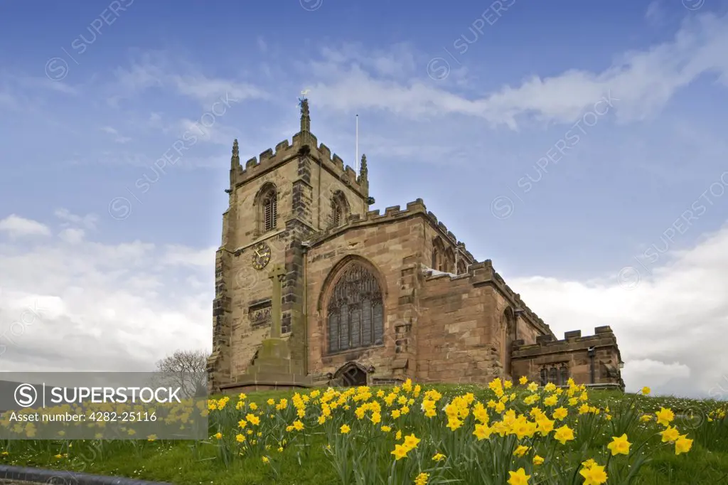 England, Cheshire, Audlem. Parish church of St. James the Great in Audlem. The present sandstone church dates from the fourteenth century, although there was an earlier building, dedicated in 1278, on the same site.