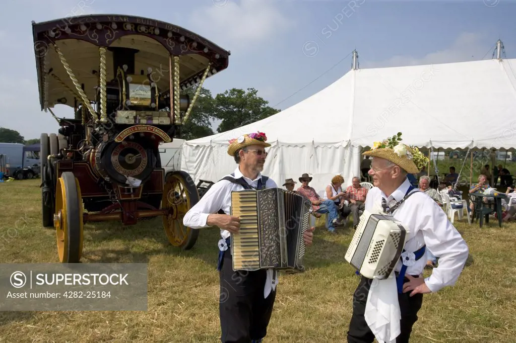 England, Hertfordshire, Whitwell. The Offley Morris Men and a Burrell Showman's Locomotive at the Whitwell Steam and Country Fair.