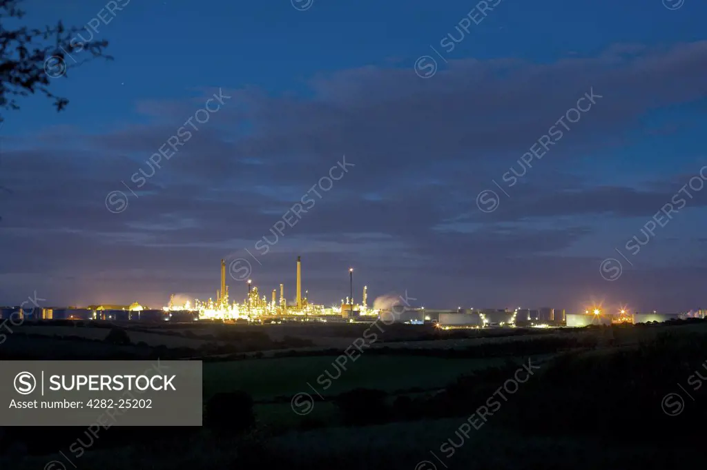 Wales, Pembrokeshire, Milford Haven. A view toward Milford Haven Oil Refinery at night.