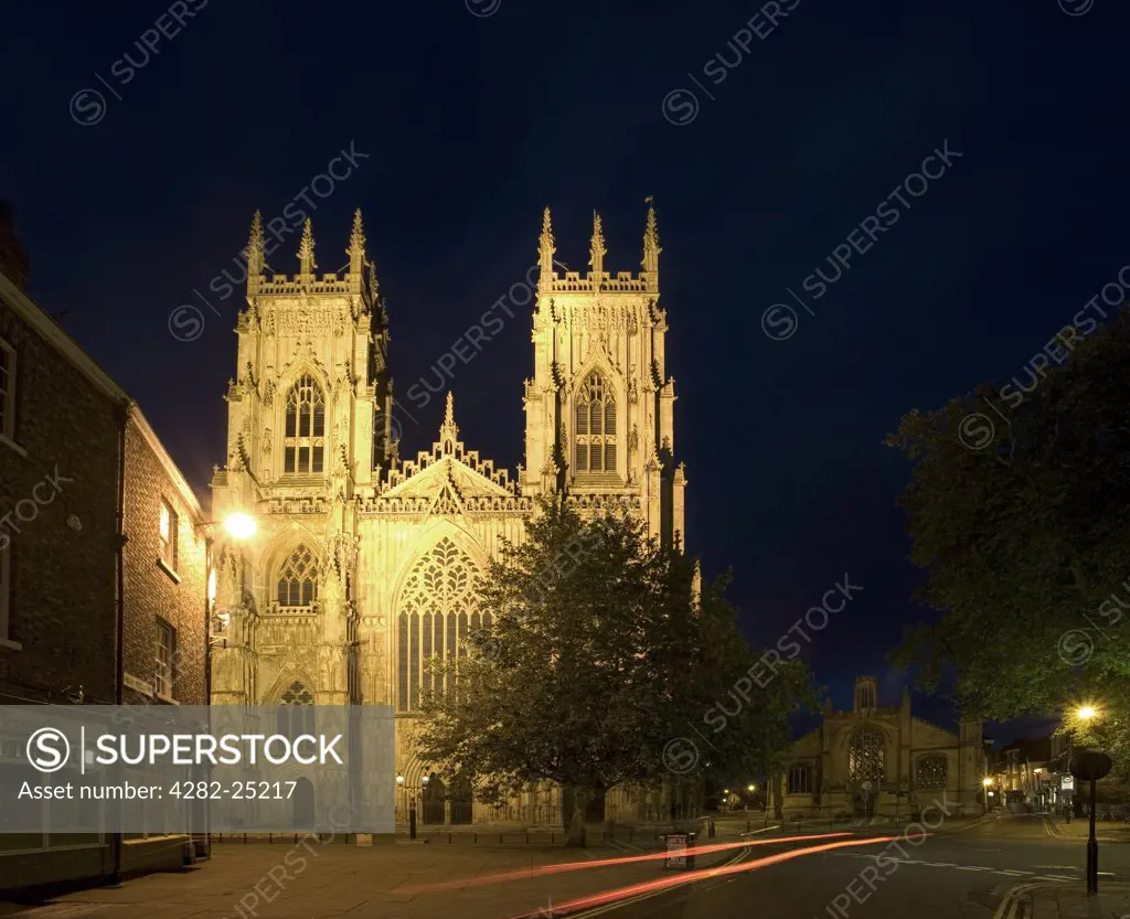 England, North Yorkshire, York. Exterior view of York Minster at night from Gilly Gate.