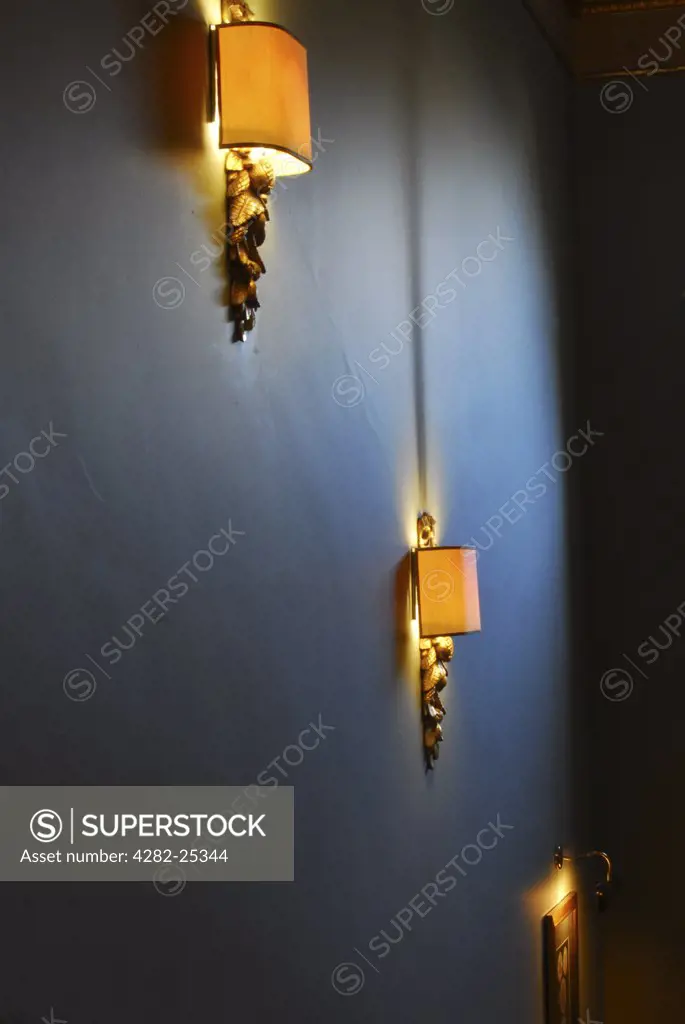 Republic of Ireland, Dublin, St Stephen's Green. Mounted lamps at a staircase in Dublins Brownes Hotel.