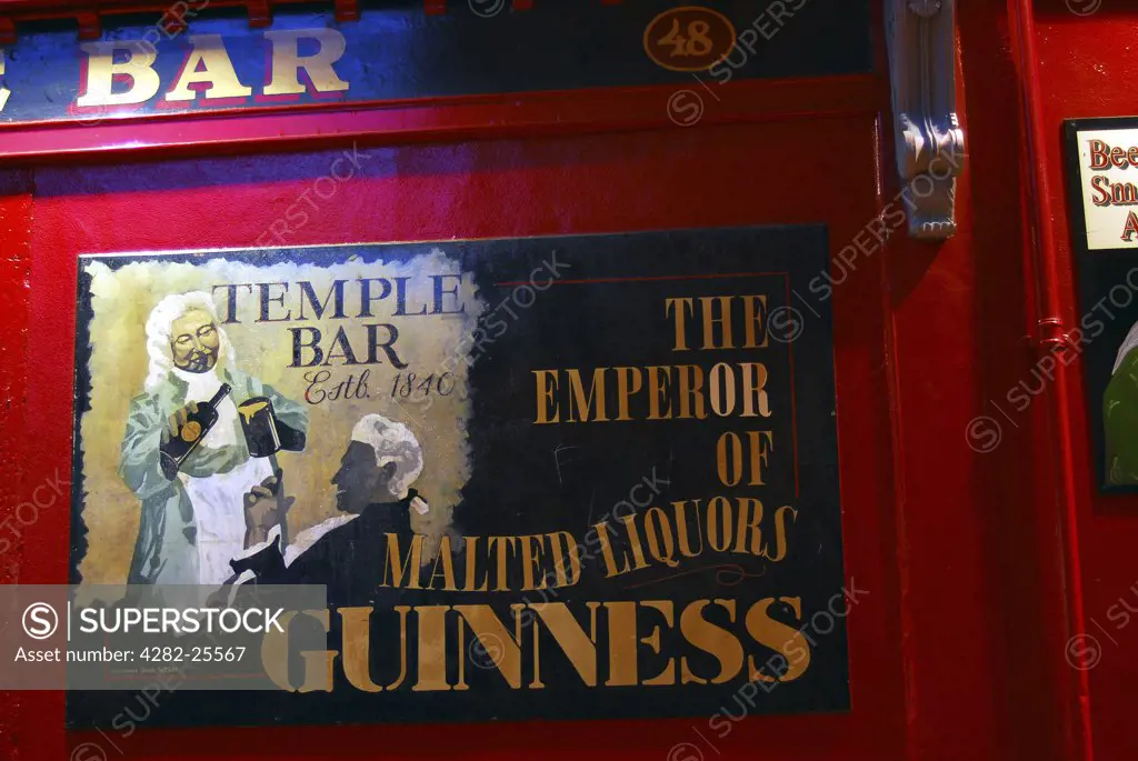 Republic of Ireland, Dublin, Temple Bar. A Guinness sign on a pub wall in the Temple Bar area of Dublin.