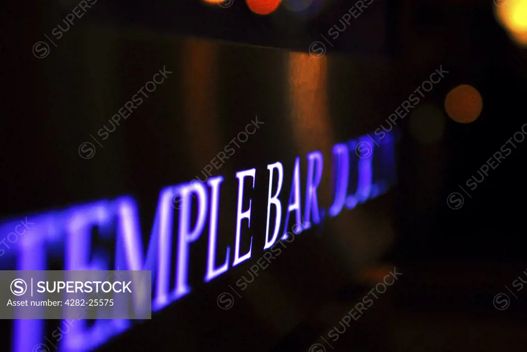Republic of Ireland, Dublin, Temple Bar. A close up of an illuminated Temple Bar sign in Dublin.