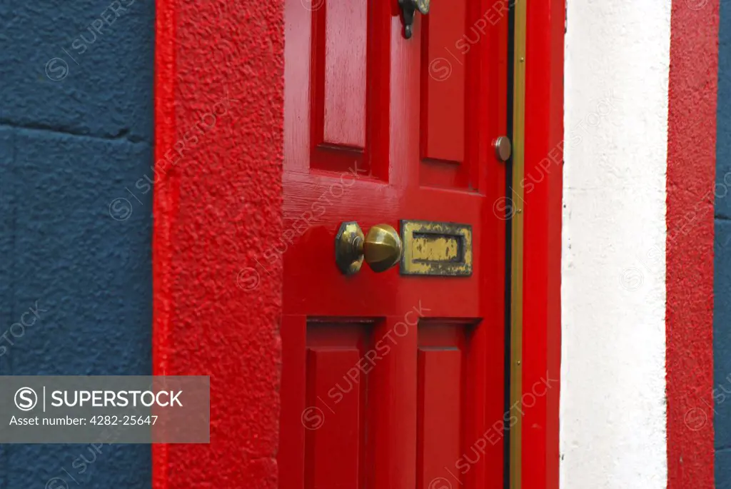 Republic of Ireland, County Cork, Shandon. Detailed view of a red door at Shandon in Cork.