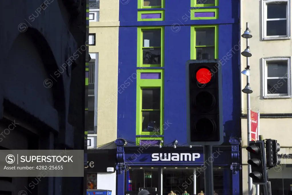 Republic of Ireland, County Cork, Central Cork. A traffic light turning red at a street scene in central Cork.