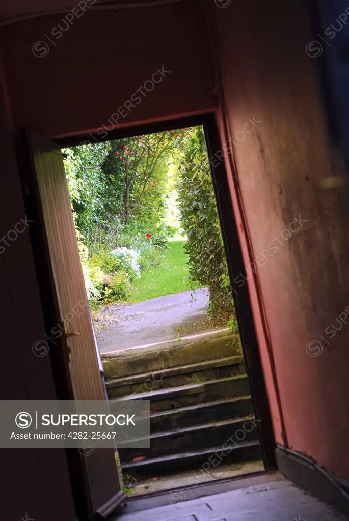 Republic of Ireland, County Cork, Central Cork. A door leading to gardens from a street in central Cork.