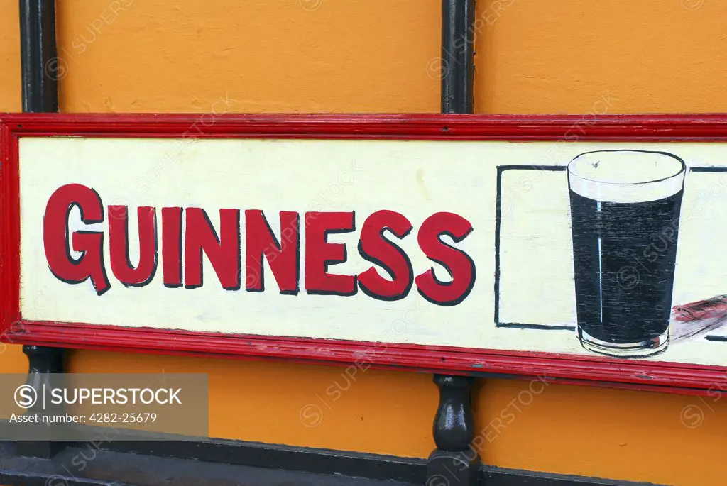 Republic of Ireland, County Cork, Central Cork. Close up of a Guinness sign outside a pub in central Cork.