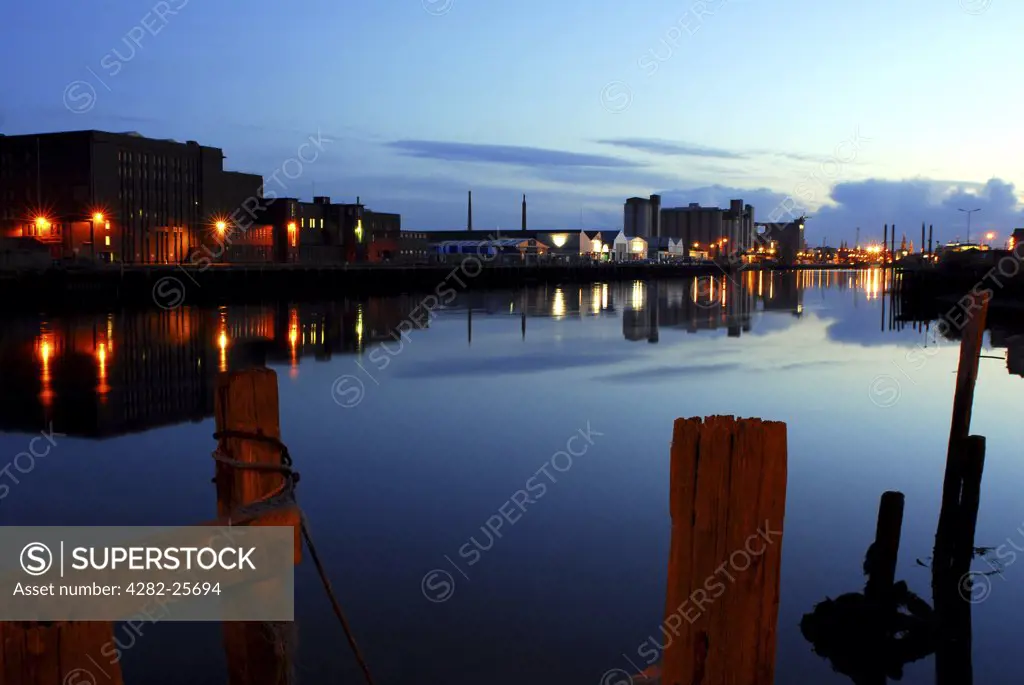 Republic of Ireland, County Cork, Docks. View across the water to the illuminated docks of Cork.