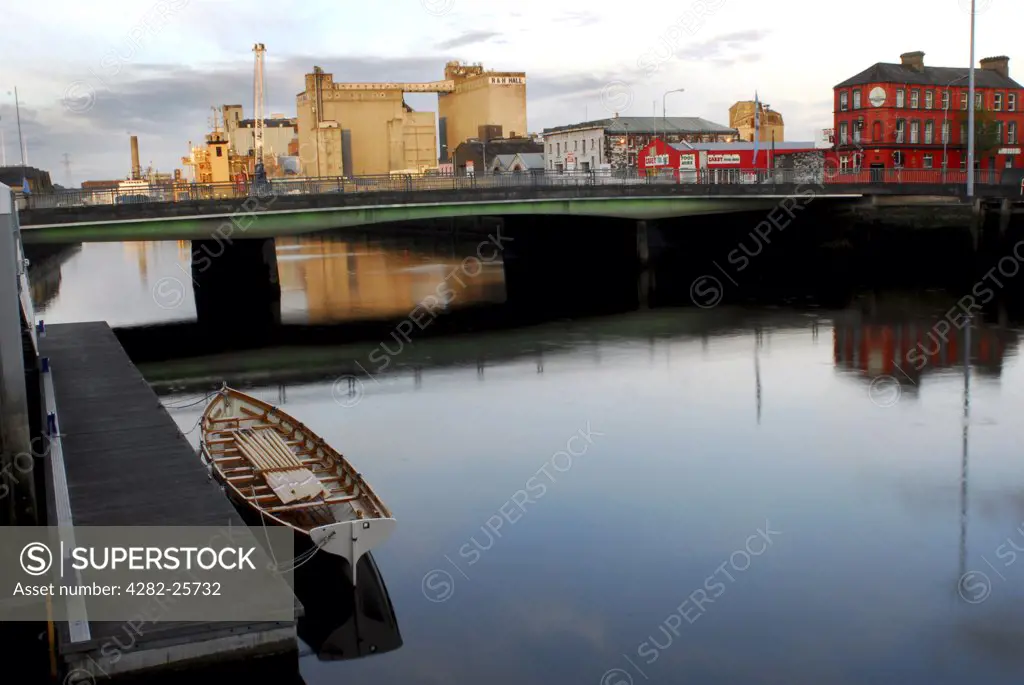 Republic of Ireland, County Cork, Cork. Dawn over the waterside buildings on the River Lee in Cork.