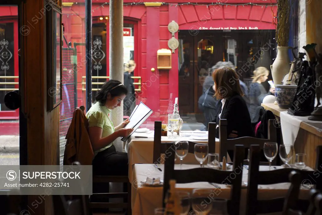 Republic of Ireland, County Cork, Cork. Two women having lunch at a restaurant in central Cork.