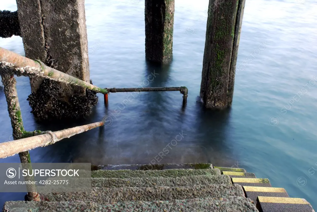 Republic of Ireland, County Cork, Cobh. Steps leading down to the water at Cobh harbour in Cork.