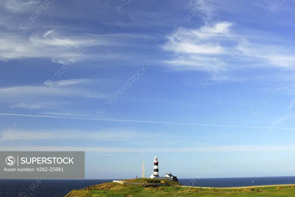Republic of Ireland, County Cork, Old Head of Kinsale Golf Course. A view to the lighthouse from Old Head of Kinsale Golf Course in Cork.