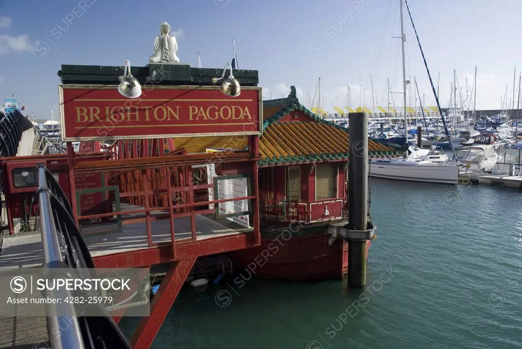 England, City of Brighton and Hove, Brighton. The Brighton Pagoda, a floating oriental restaurant and fine art gallery in Brighton Marina.