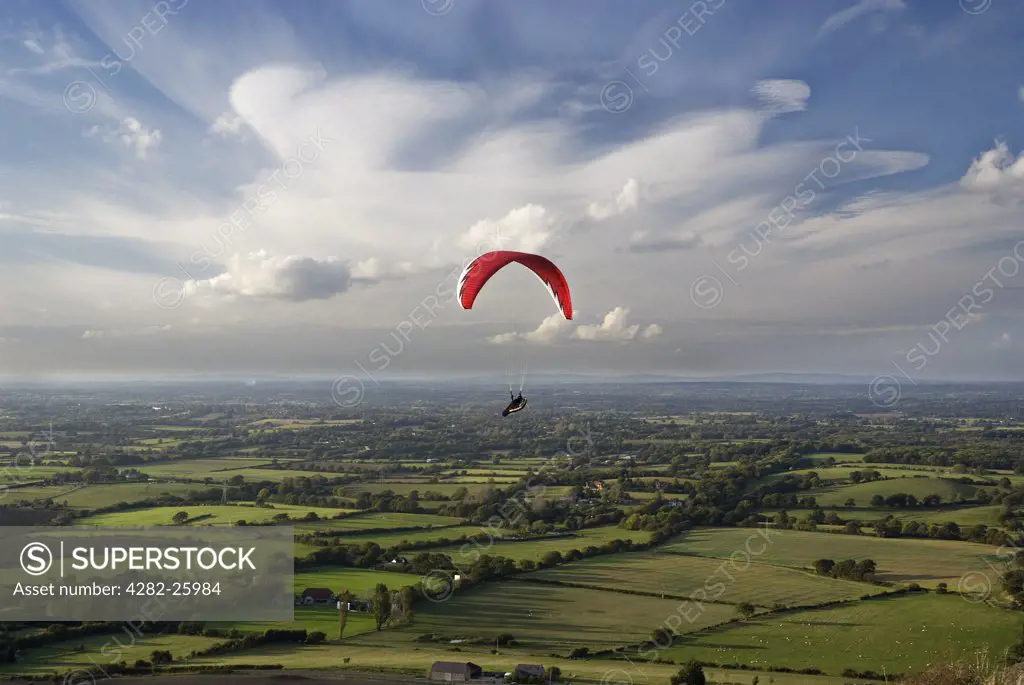 England, West Sussex, Devil's Dyke. A Paraglider free-flying over Devil's Dyke.