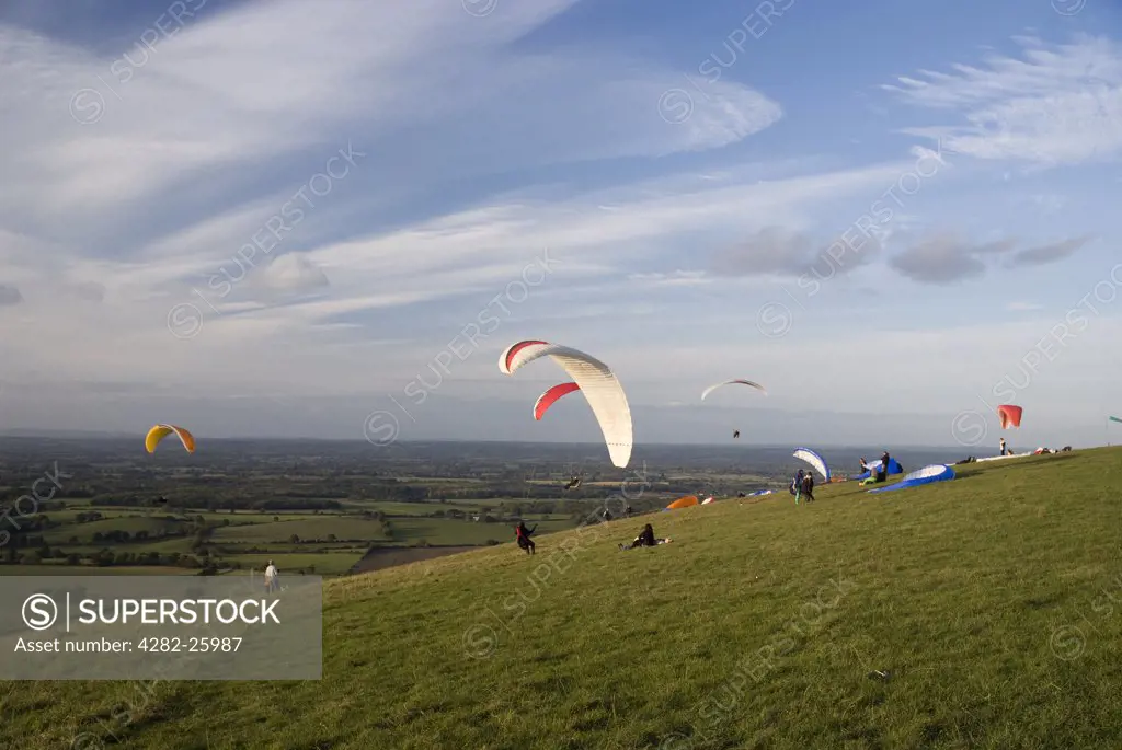 England, West Sussex, Devil's Dyke. Paragliders struggling with the wind on Devil's Dyke.