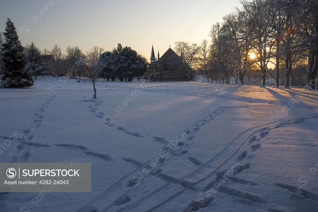 England, Surrey, Epsom. Footprints in the snow near Epsom College school.