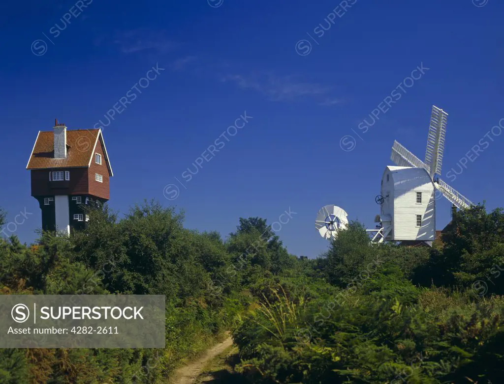 England, Suffolk, Thorpeness. Windmill and House in the Clouds.