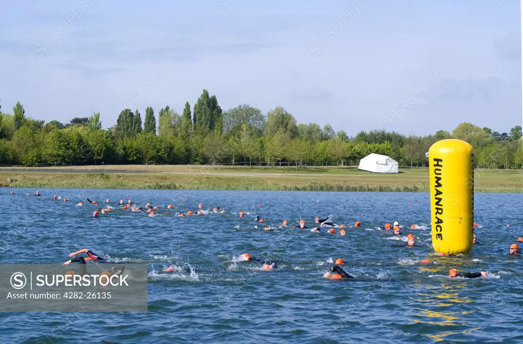 England, Berkshire, Windsor. Swimmers rounding a buoy during a Triathlon event at Eton Dorney, the venue for Rowing, Paralympic Rowing and Canoe Sprint events during the London 2012 Games.