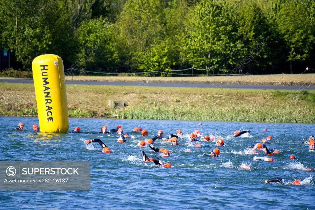 England, Berkshire, Windsor. Swimmers rounding a buoy during a Triathlon event at Eton Dorney, the venue for Rowing, Paralympic Rowing and Canoe Sprint events during the London 2012 Games.