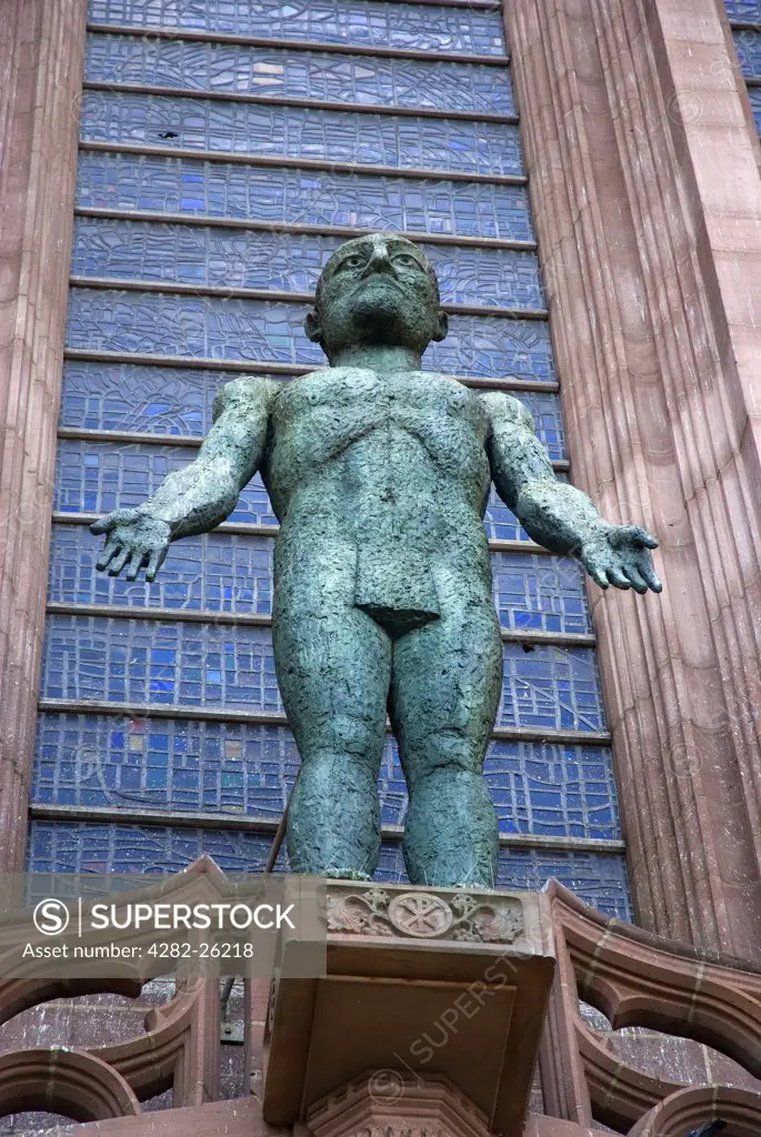 England, Merseyside, Liverpool. 'Risen Christ' sculpture by Elisabeth Frink over the West entrance to Liverpool Cathedral, the largest in Britain and the fifth largest in the world.