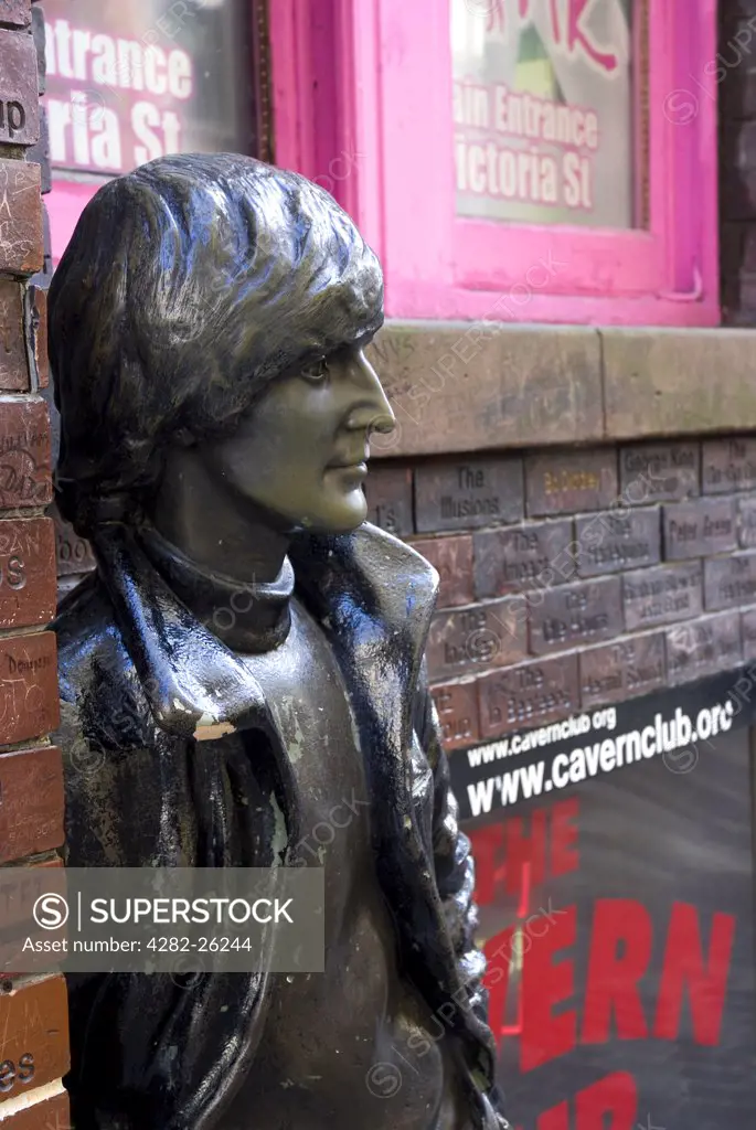 England, Merseyside, Liverpool. Statue of John Lennon outside the Cavern Club, the venue where Brian Epstein first saw The Beatles performing in 1961.