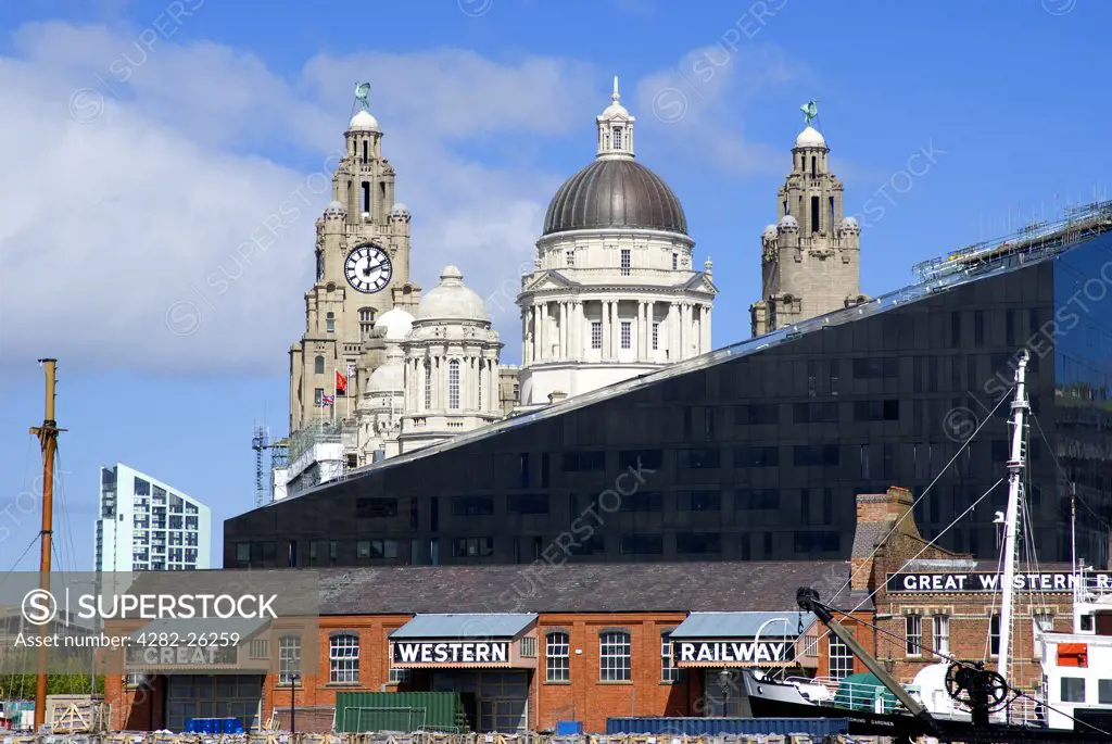 England, Merseyside, Liverpool. The changing skyline of Liverpool featuring modern apartment blocks with the Three Graces.