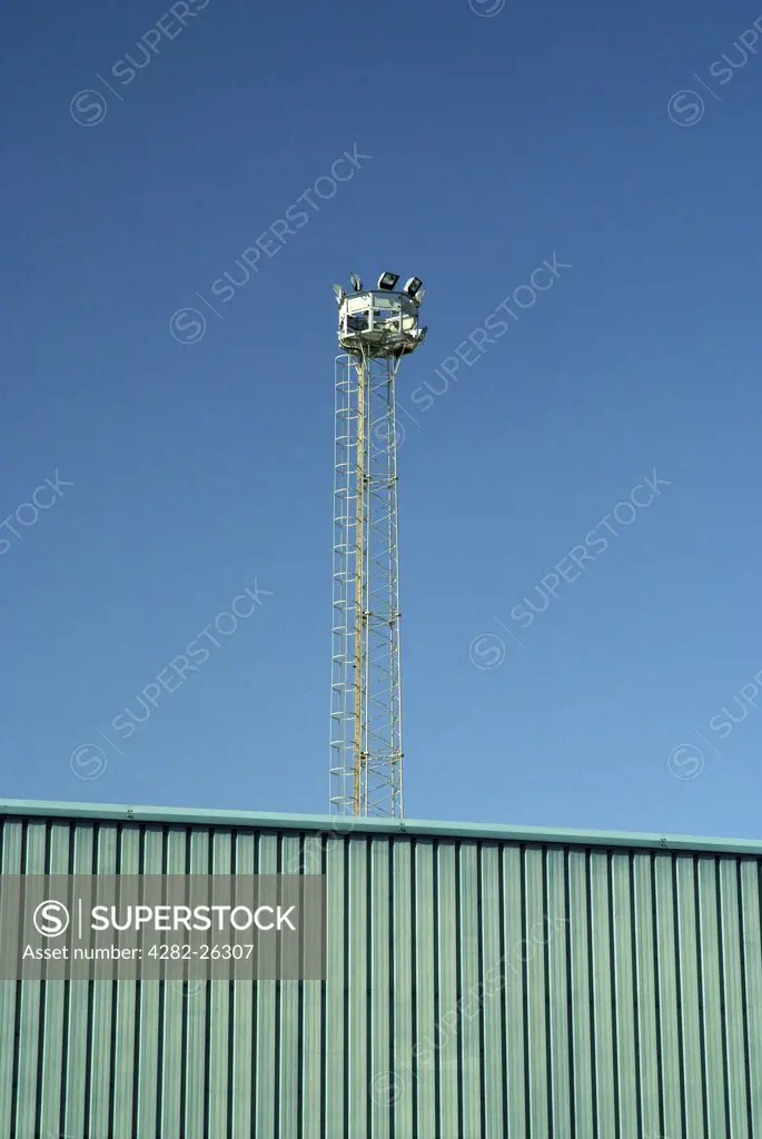 England, West Sussex, Portslade-By-Sea. A security mast overlooking a builders compound in Portslade.