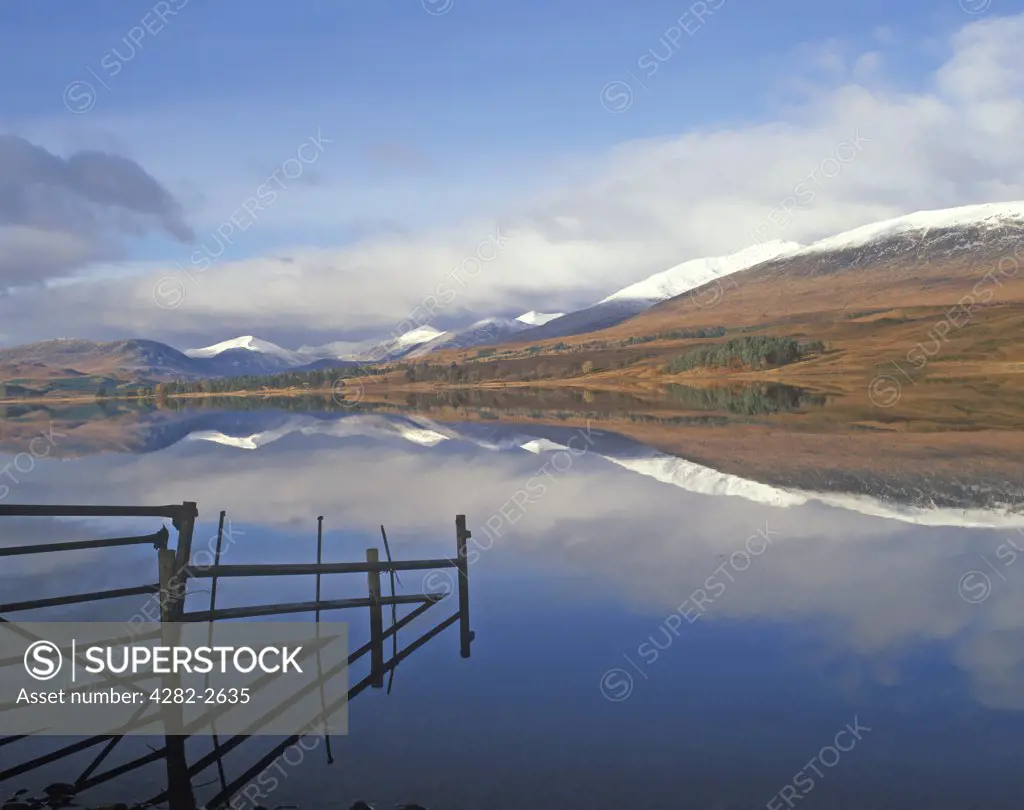 Scotland, Argyll & Bute, Loch Tulla. Snow capped mountains reflected in the still water of Loch Tulla.