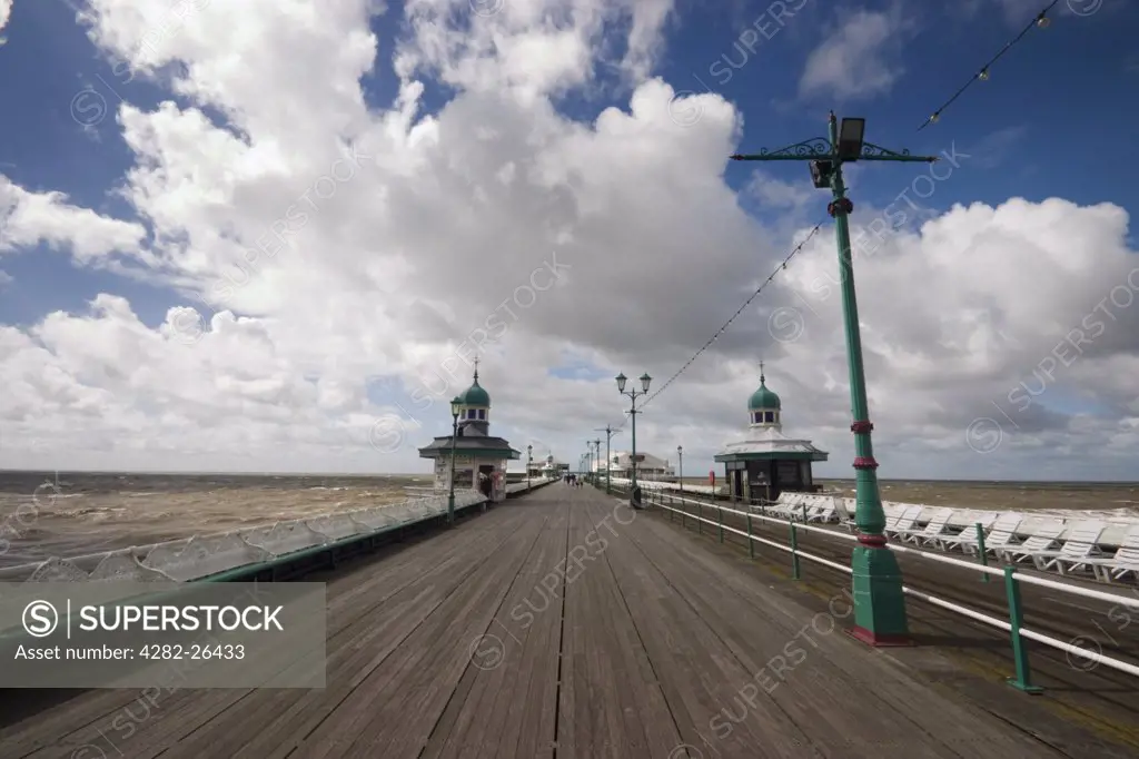 England, Lancashire, Blackpool. Perspective view along the length of a pier at Blackpool.