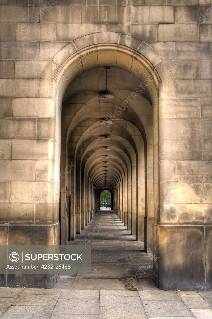 England, Greater Manchester, Manchester. An arched walkway in Manchester Town Hall.