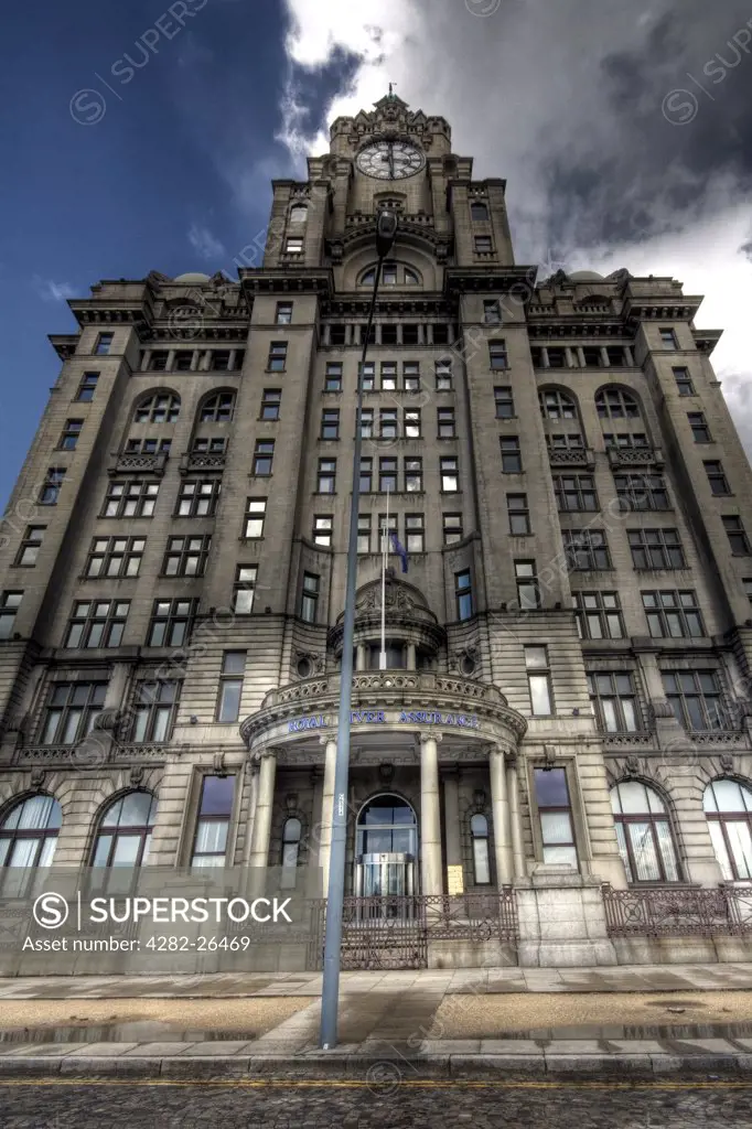 England, Merseyside, Liverpool. The Royal Liver Building following a storm. The building is one of the Three Graces found at Liverpool Pier Head.