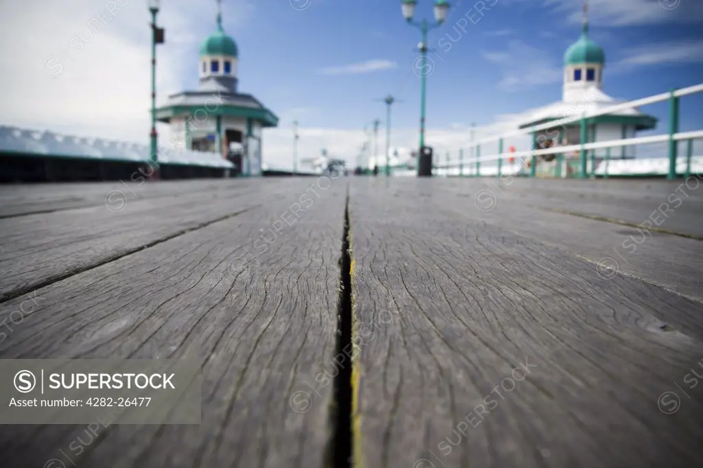 England, Lancashire, Blackpool. View along the boards of the North Pier in Blackpool.