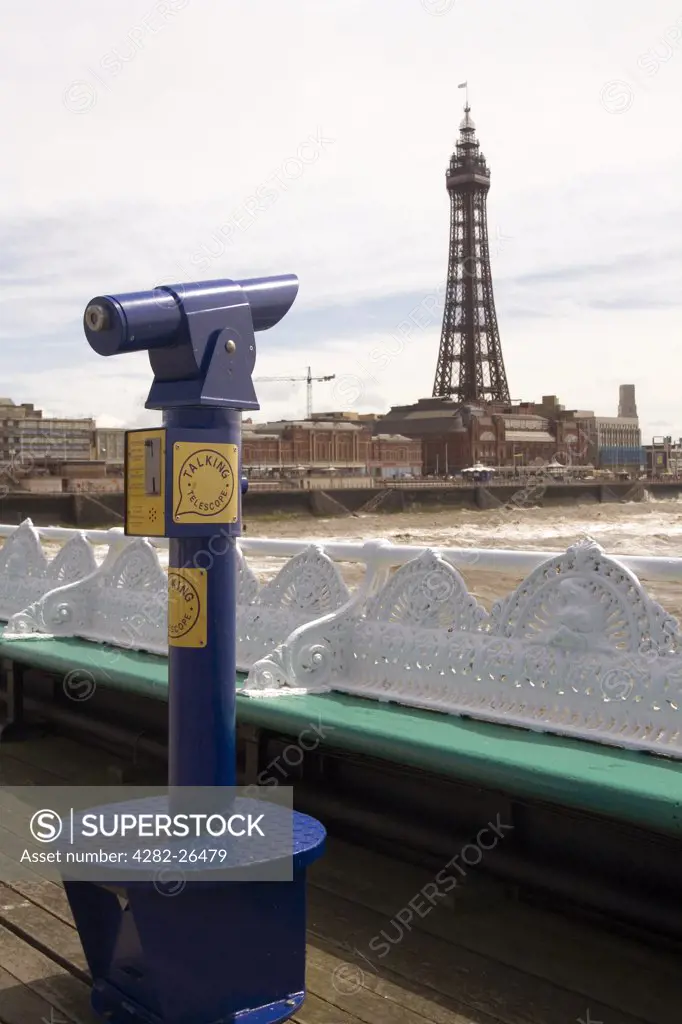 England, Lancashire, Blackpool. Blackpool Tower and a telescope on the North Pier.