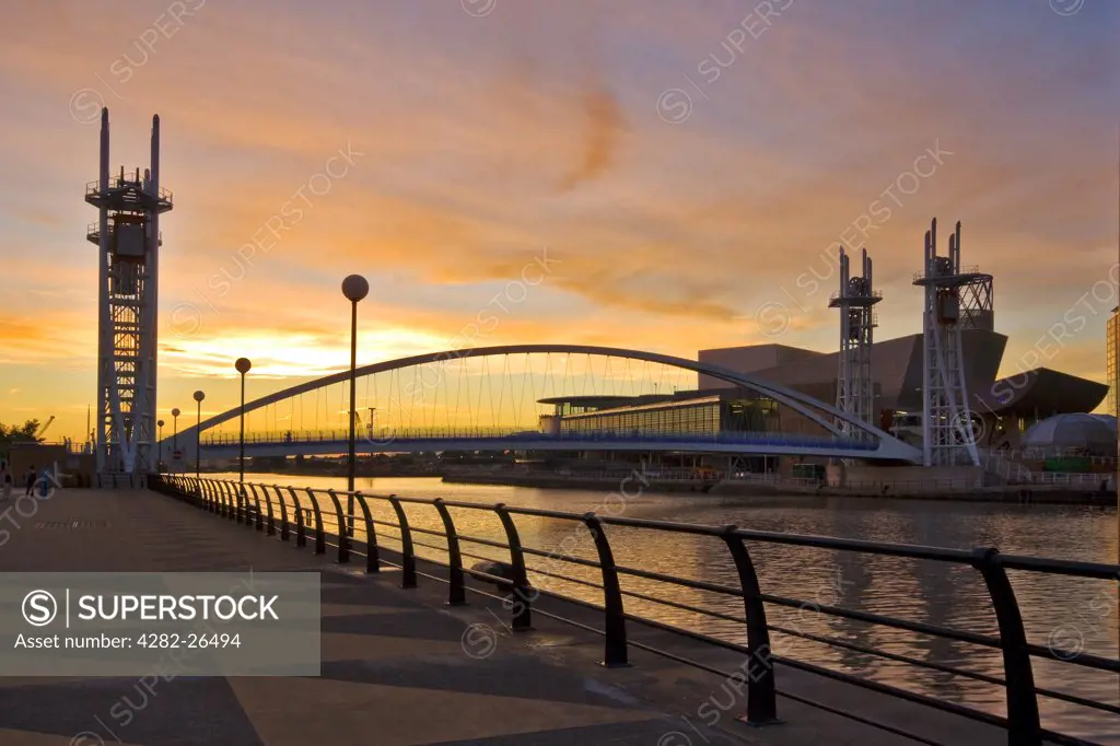 England, Greater Manchester, Salford Quays. The Millennium Bridge spanning the Manchester Ship Canal at Salford Quays.