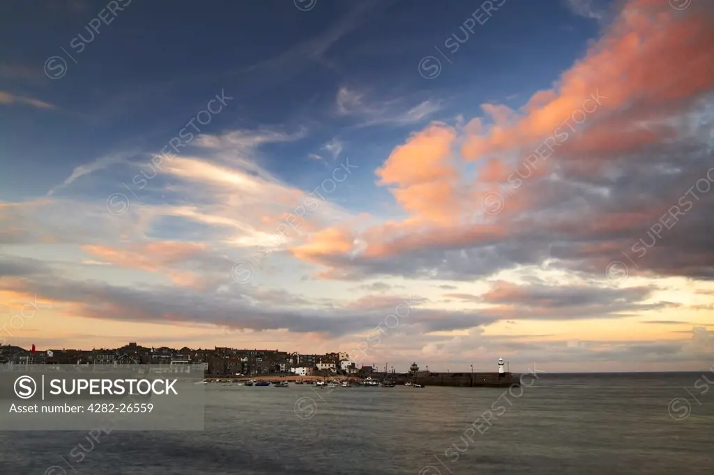 England, Cornwall, St Ives. Sunset clouds above St Ives harbour in Cornwall.