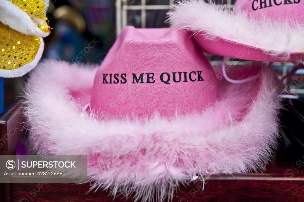 England, Lancashire, Blackpool. A pink Kiss Me Quick hat for sale on the seafront at Blackpool.