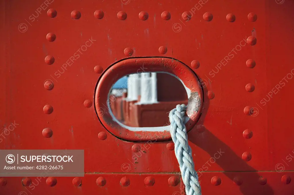 England, Merseyside, Liverpool. Portal and rope on the side of a ship.