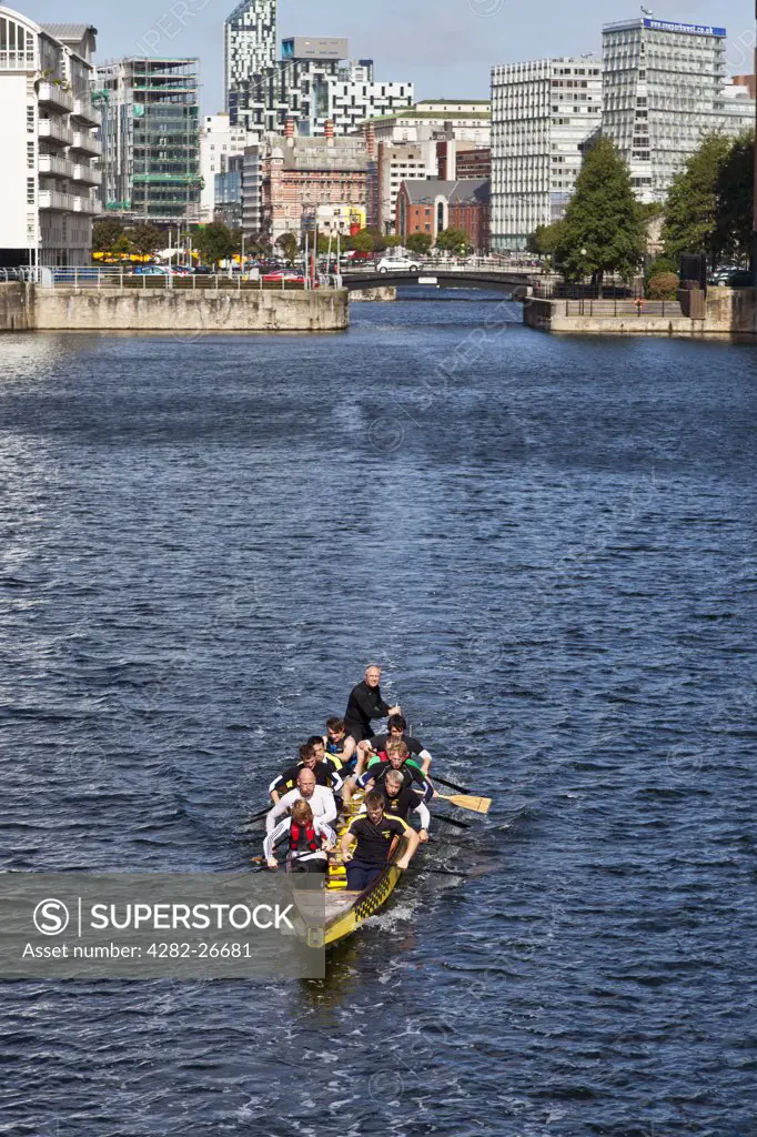 England, Merseyside, Liverpool. A Dragon boat training session in Wapping Dock.