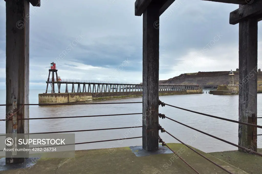 England, North Yorkshire, Whitby. The new and old lighthouses on Whitby east pier.