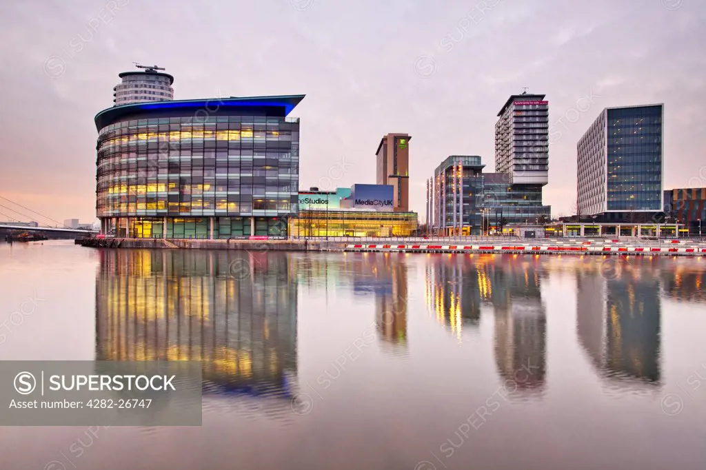 England, Greater Manchester, Manchester. View across Salford Quays to the new MediaCityUK development on Pier 9. The BBC are due to complete the move of five departments to the area by 2012.