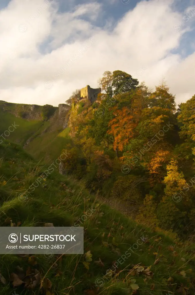 England, Derbyshire, Castleton. The remains of Peveril Castle. The slopes of Mam Tor and Winnats Pass make up the backdrop.