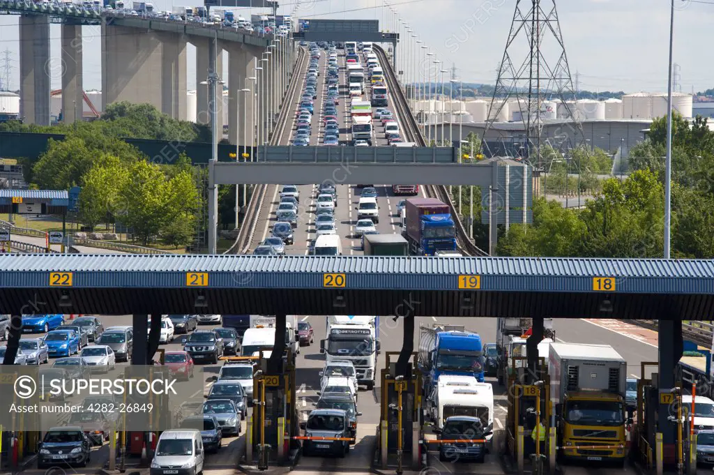England, Kent, Dartford. Traffic queueing at the toll booths at the end of the QE2 Bridge (Dartford River Crossing) as it moves into Kent from Essex.