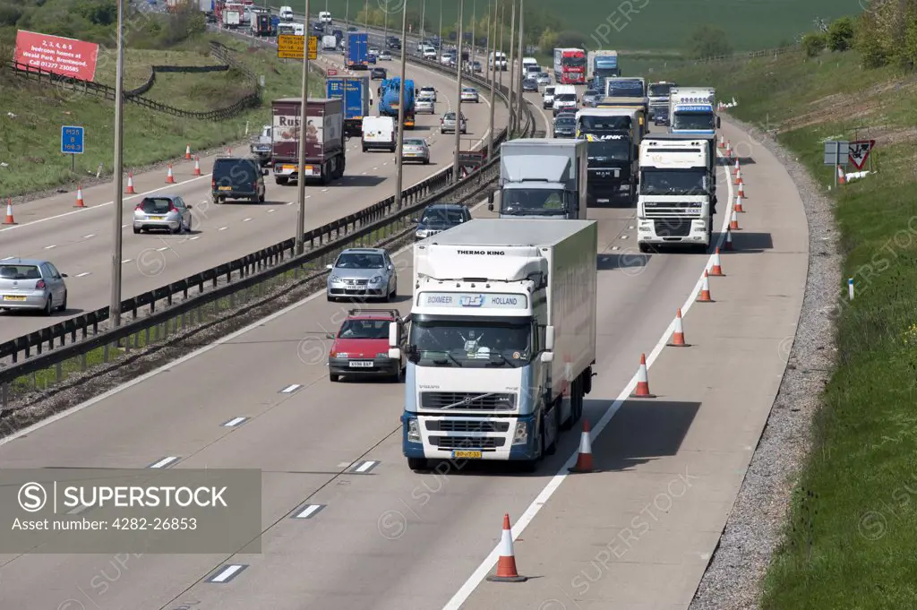 England, Essex, M25. A constant stream of traffic passing through Essex on the M25 London Orbital Motorway.